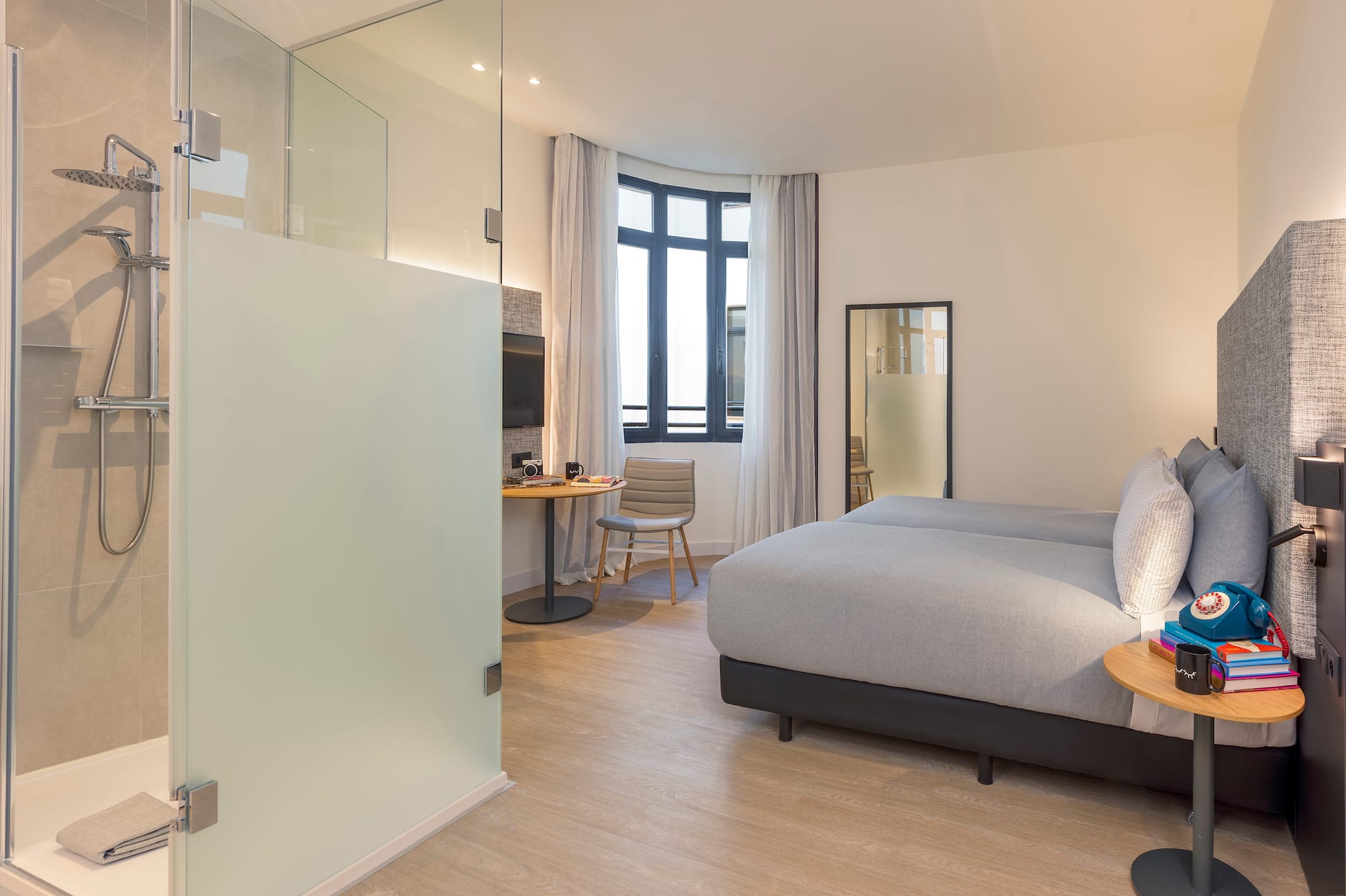 a bedroom with a bed and a desk