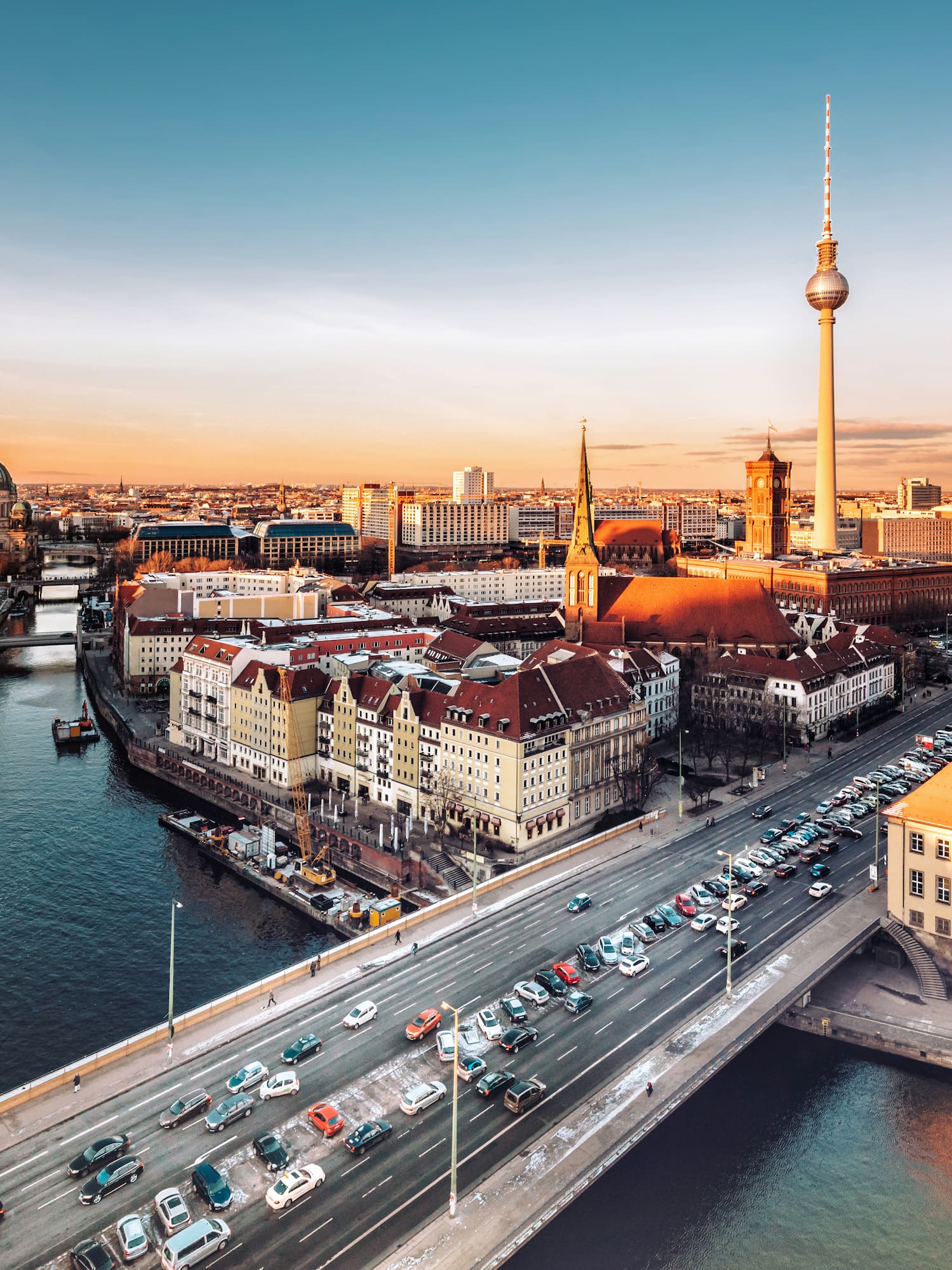 a city with a bridge and a river