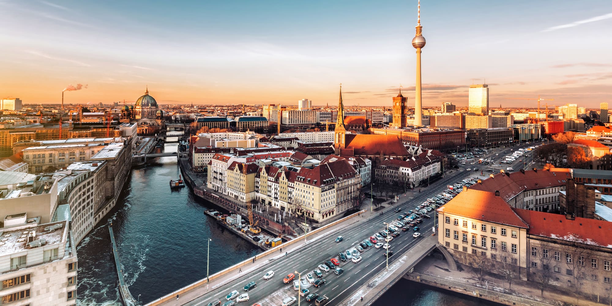 a city with a bridge and a river