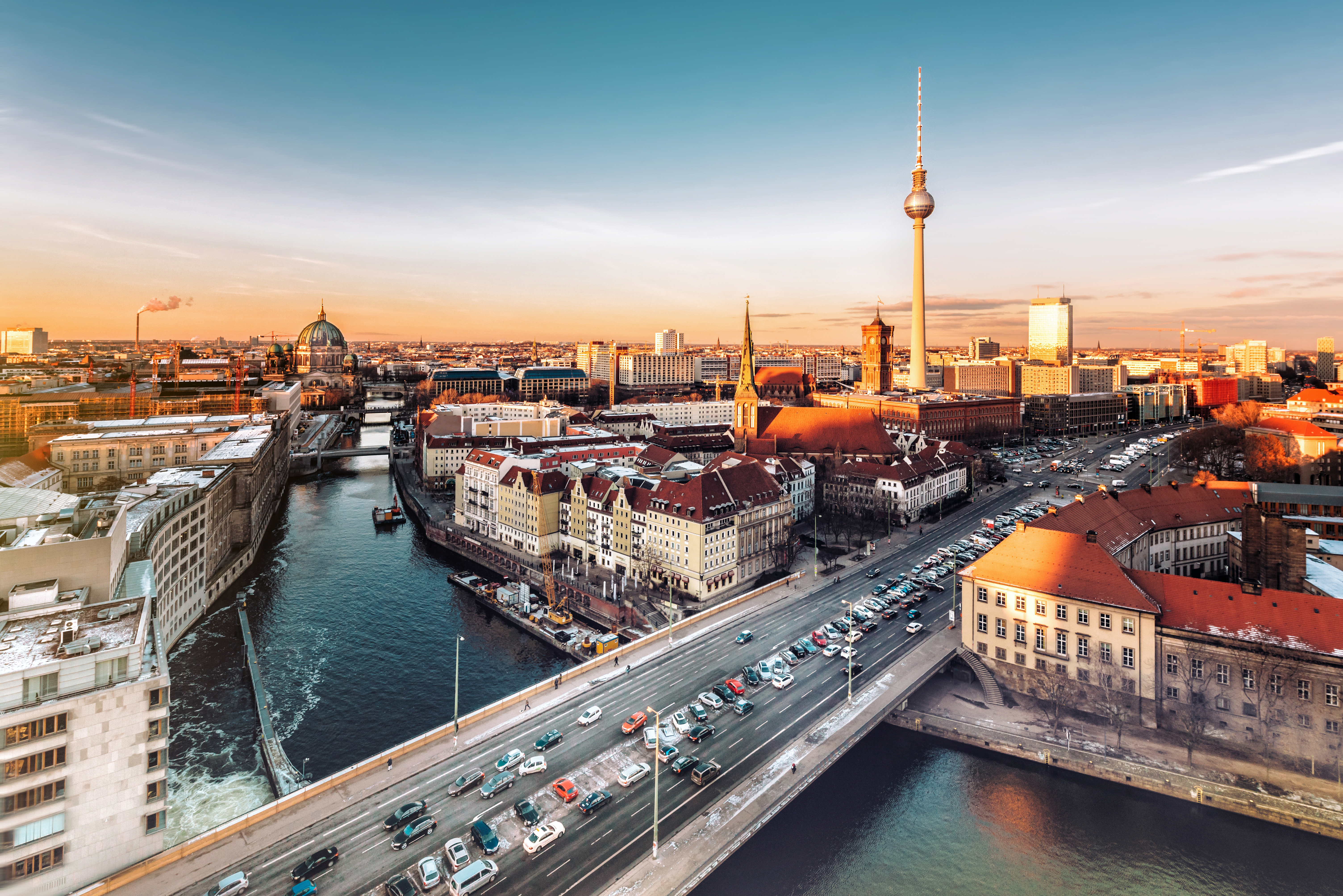 a city with a bridge and a river