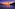 a bridge over water at sunset
