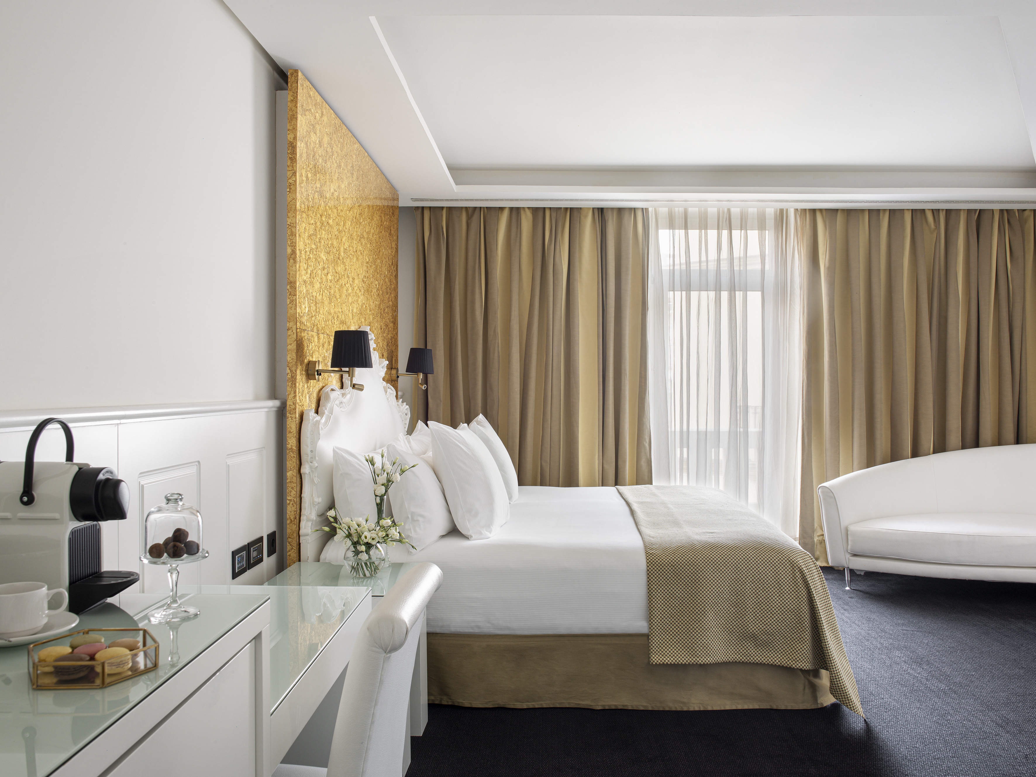 a room with a bed and a desk