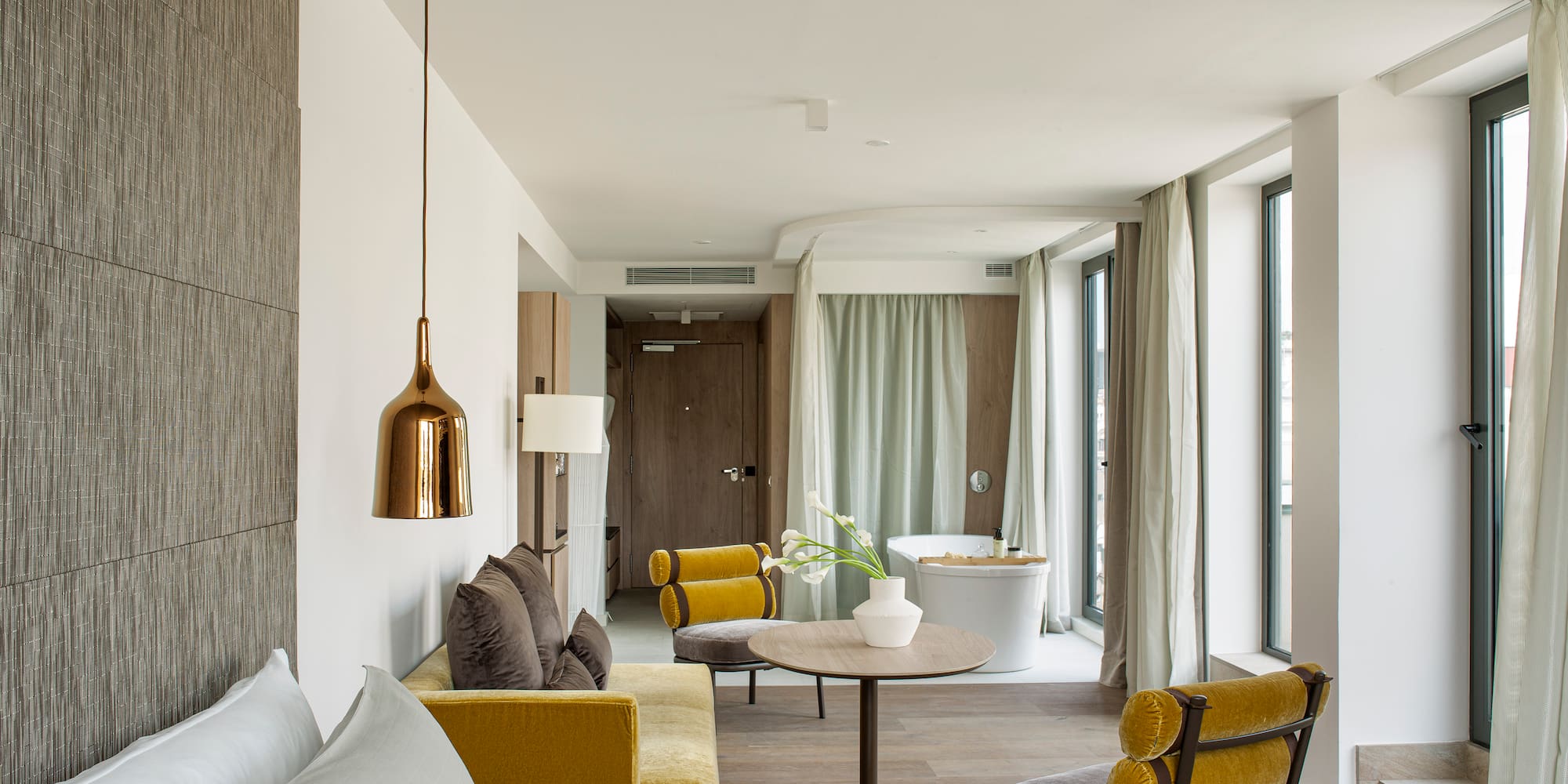 a room with a bed and a tub