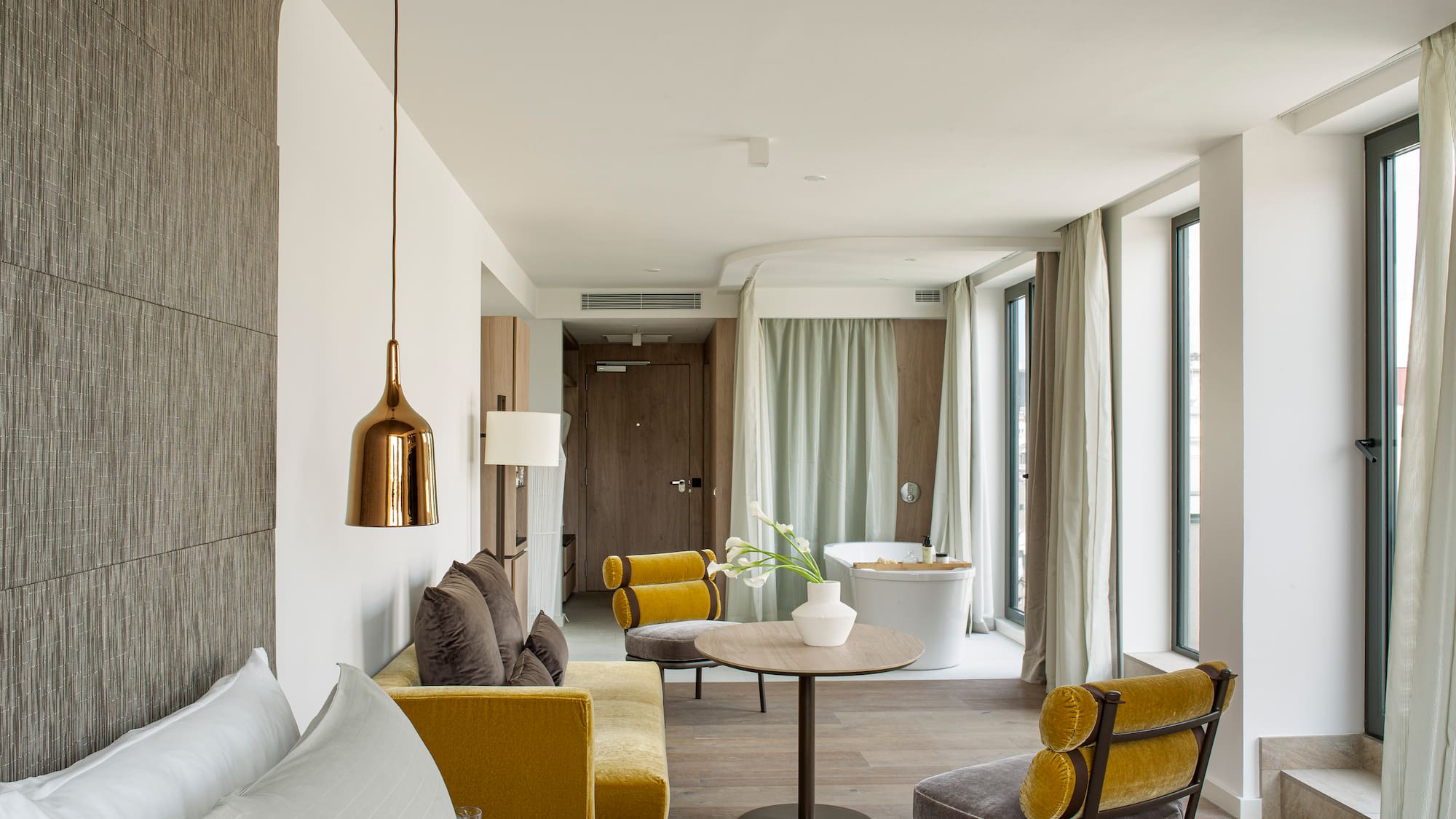 a room with a bed and a tub