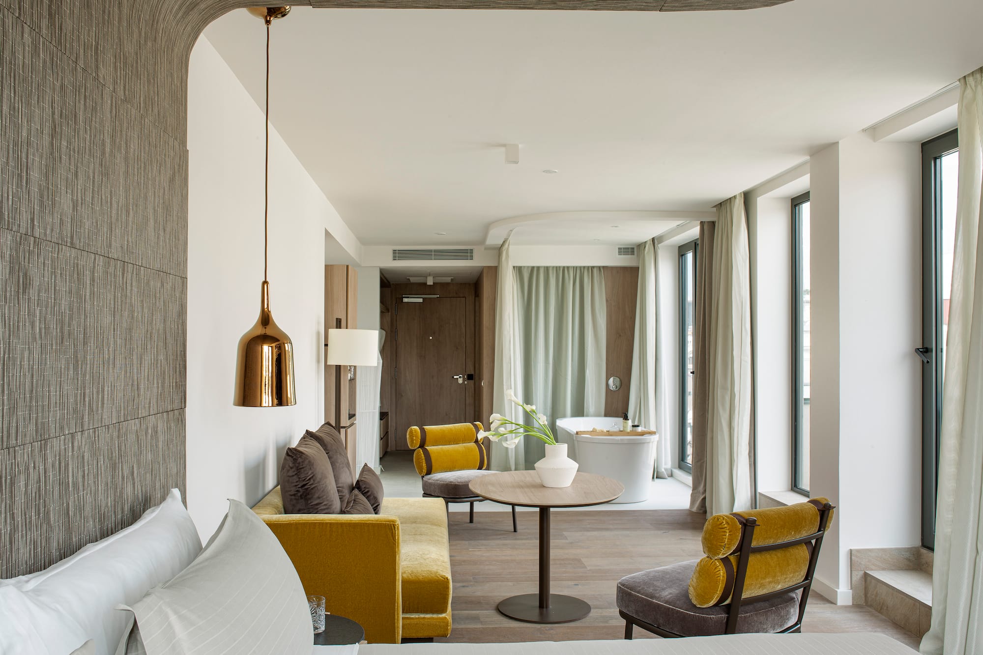 a room with a bed and a tub