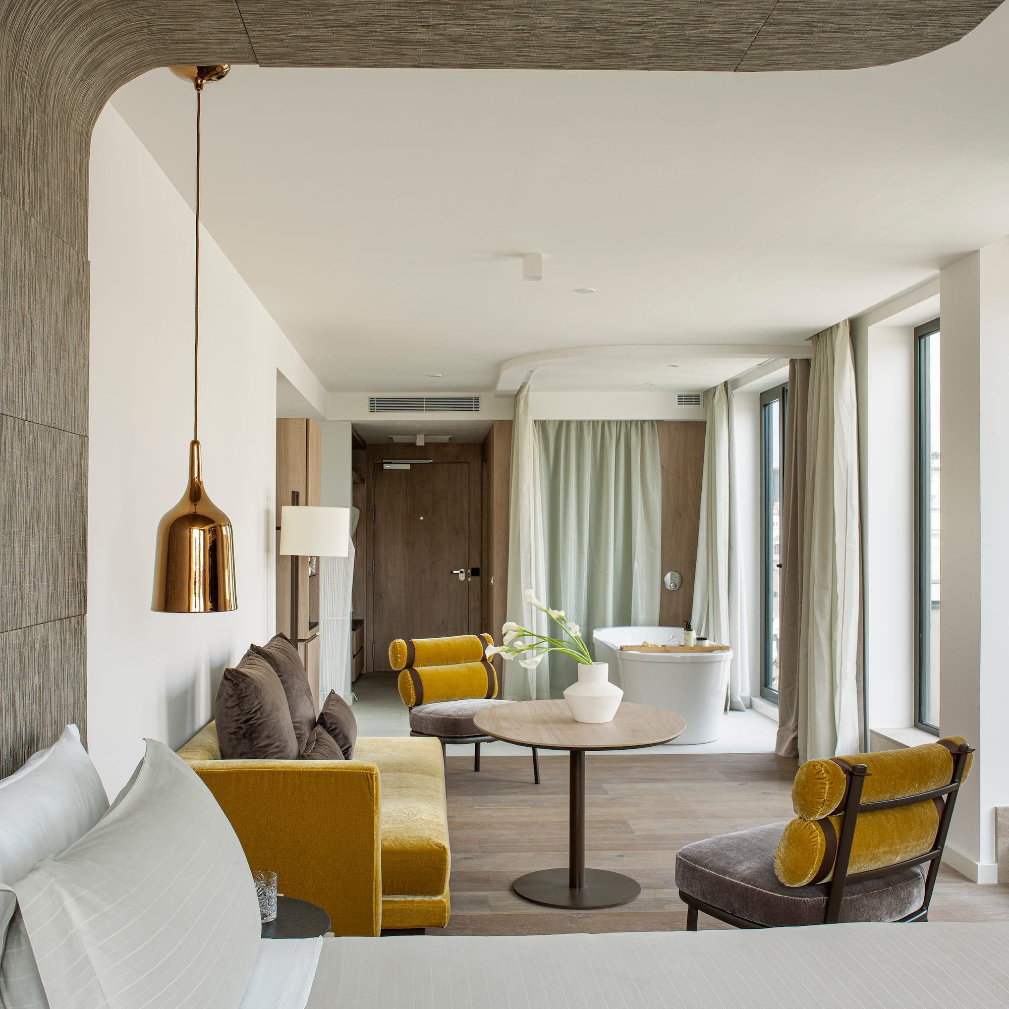 a room with a bed and a tub