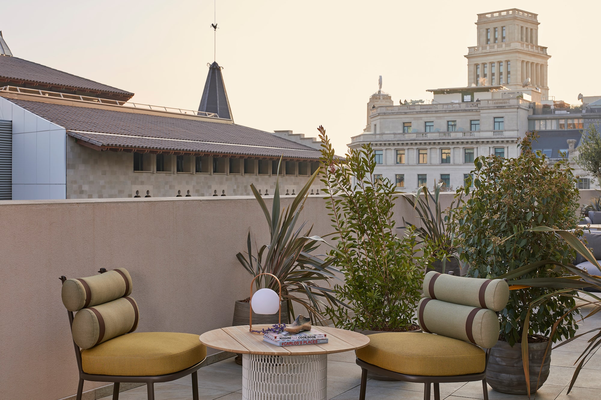 a patio with chairs and a table