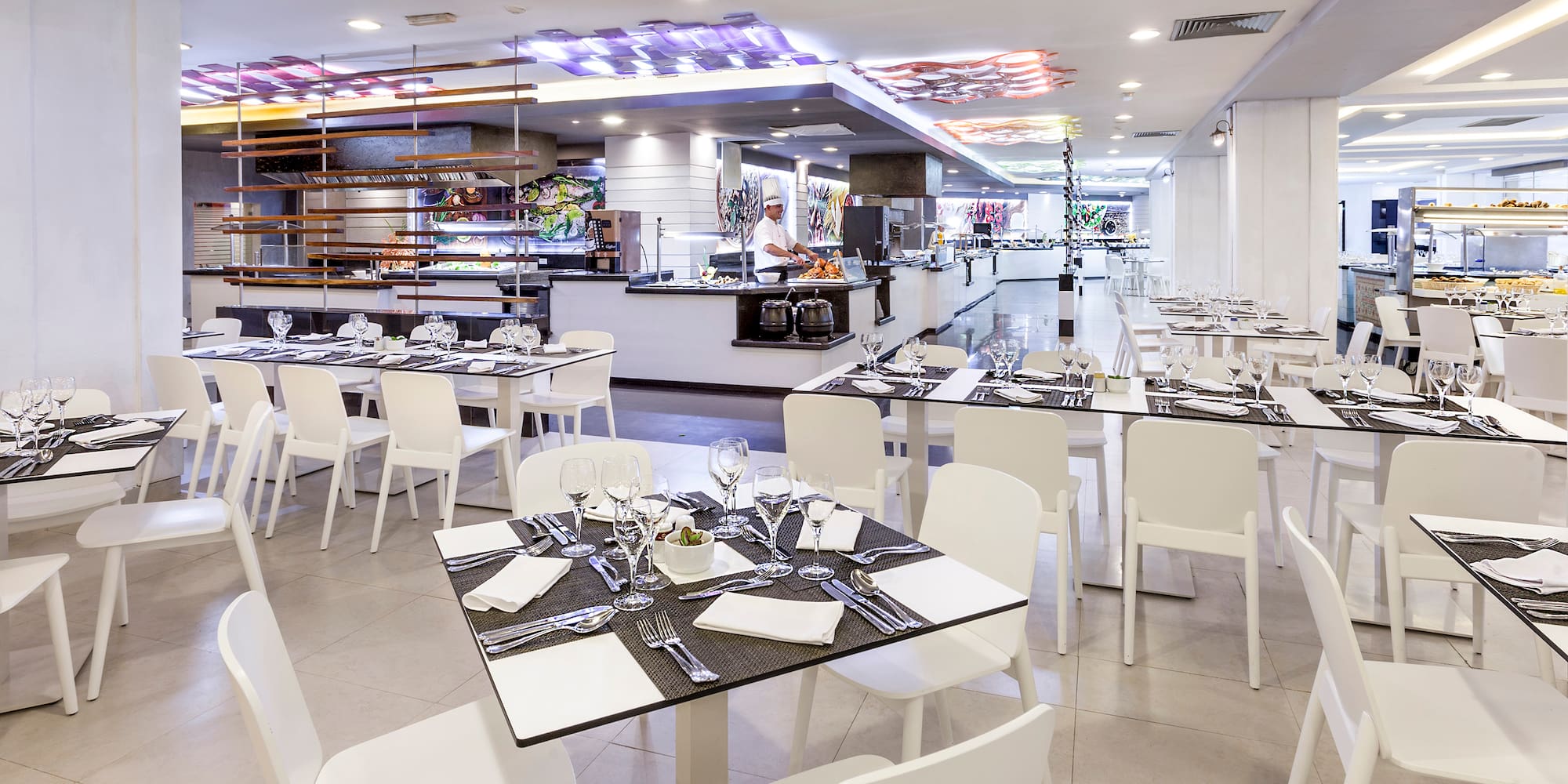 a restaurant with tables and chairs