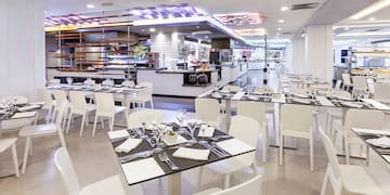 a restaurant with tables and chairs