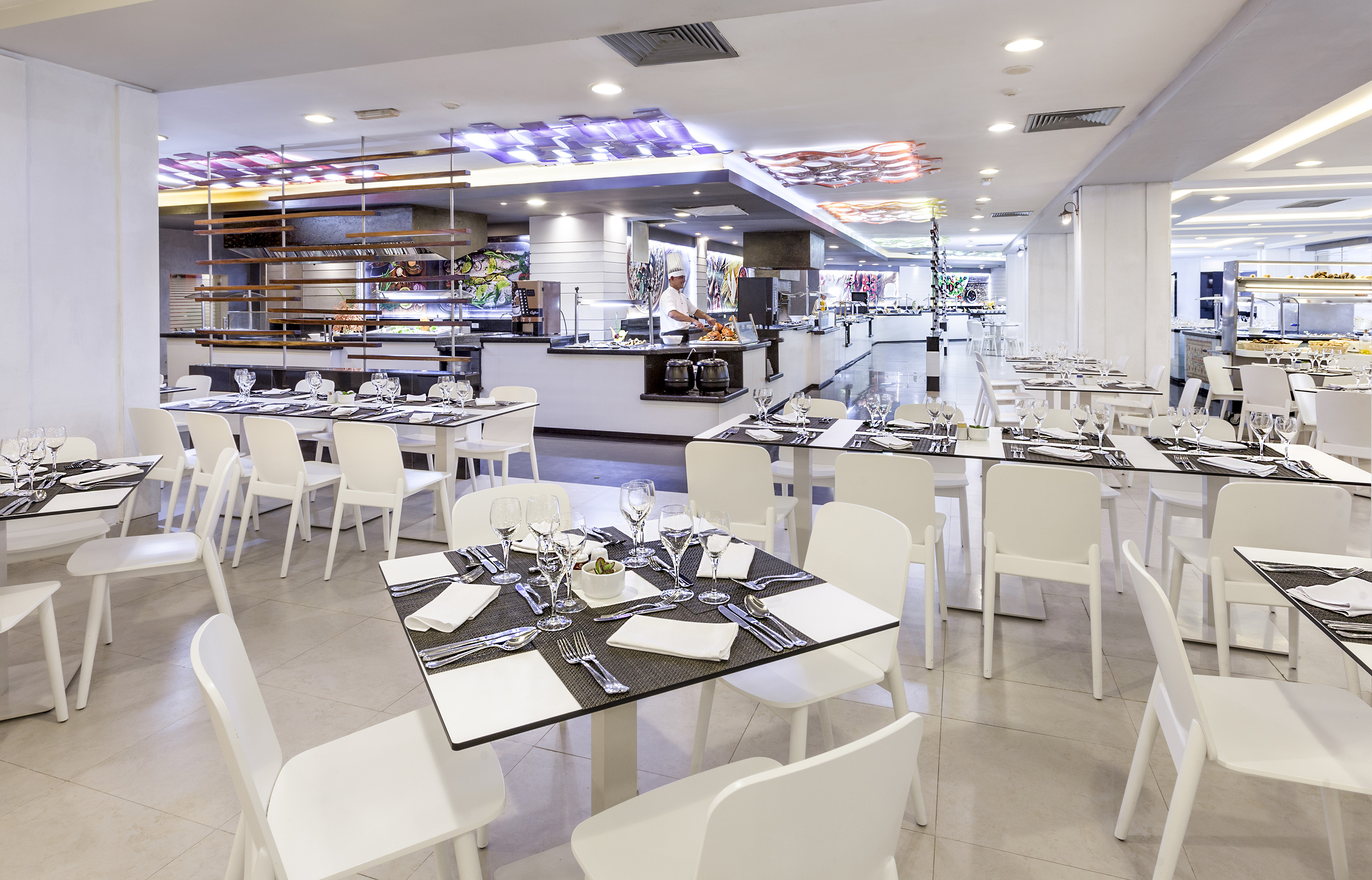 a restaurant with tables and chairs