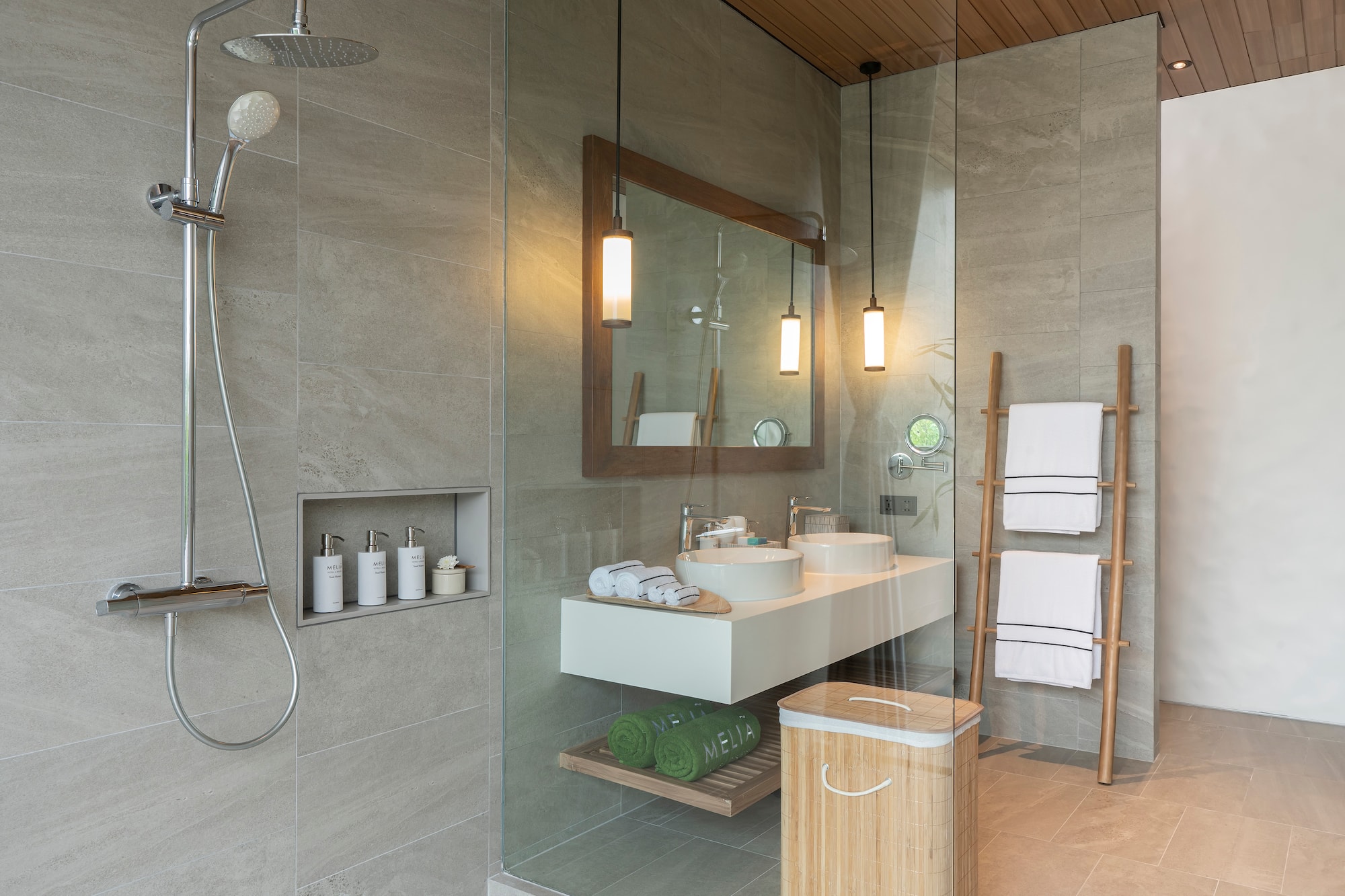 a bathroom with a shower and a sink