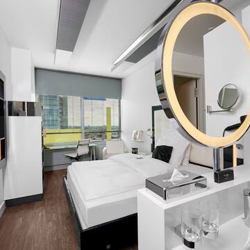 a room with a round mirror
