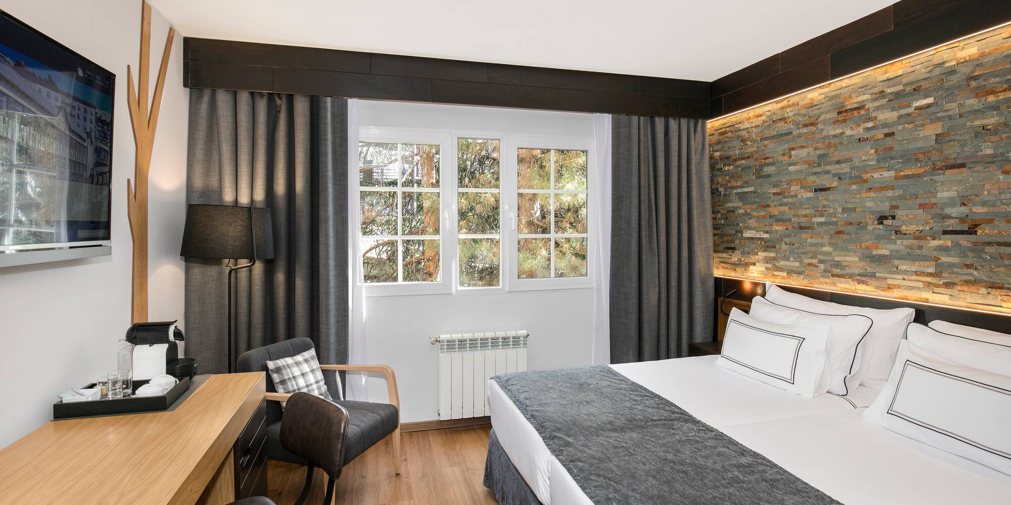 a room with a bed and a desk