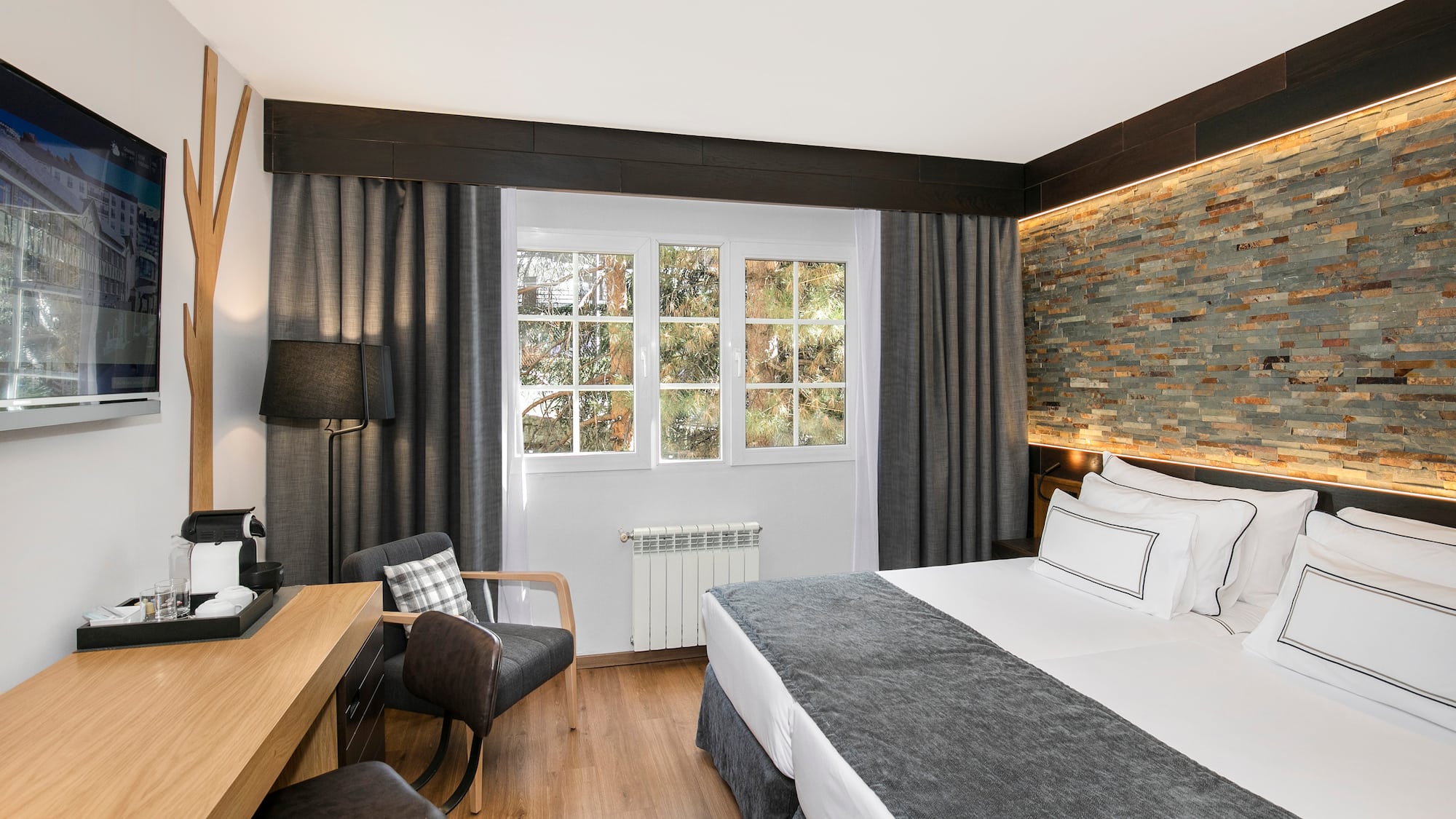 a room with a bed and a desk