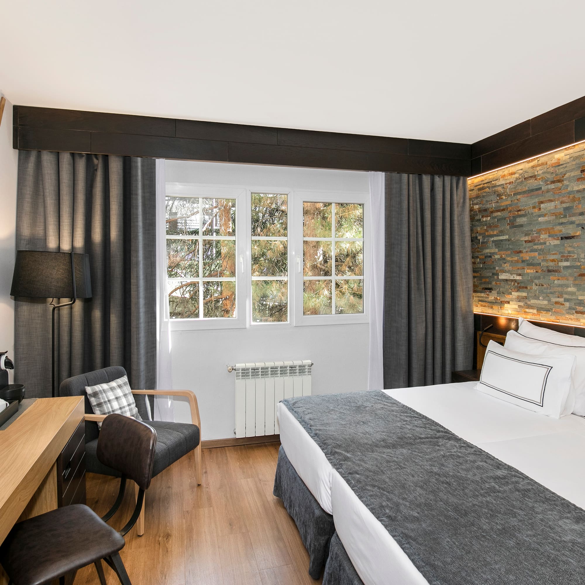 a room with a bed and a desk