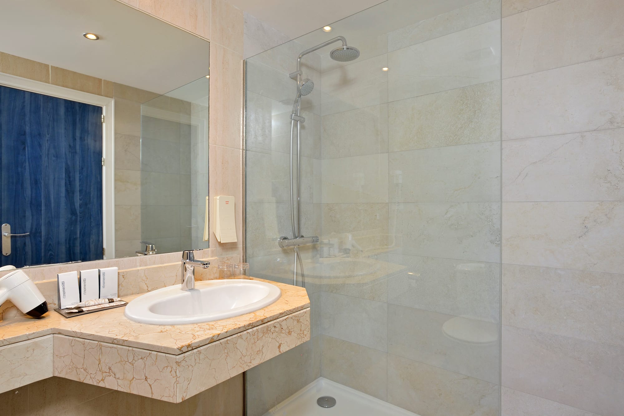 a bathroom with a shower and sink