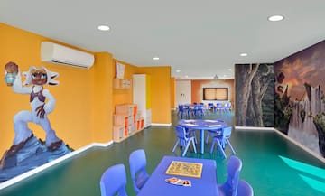 a room with blue chairs and tables