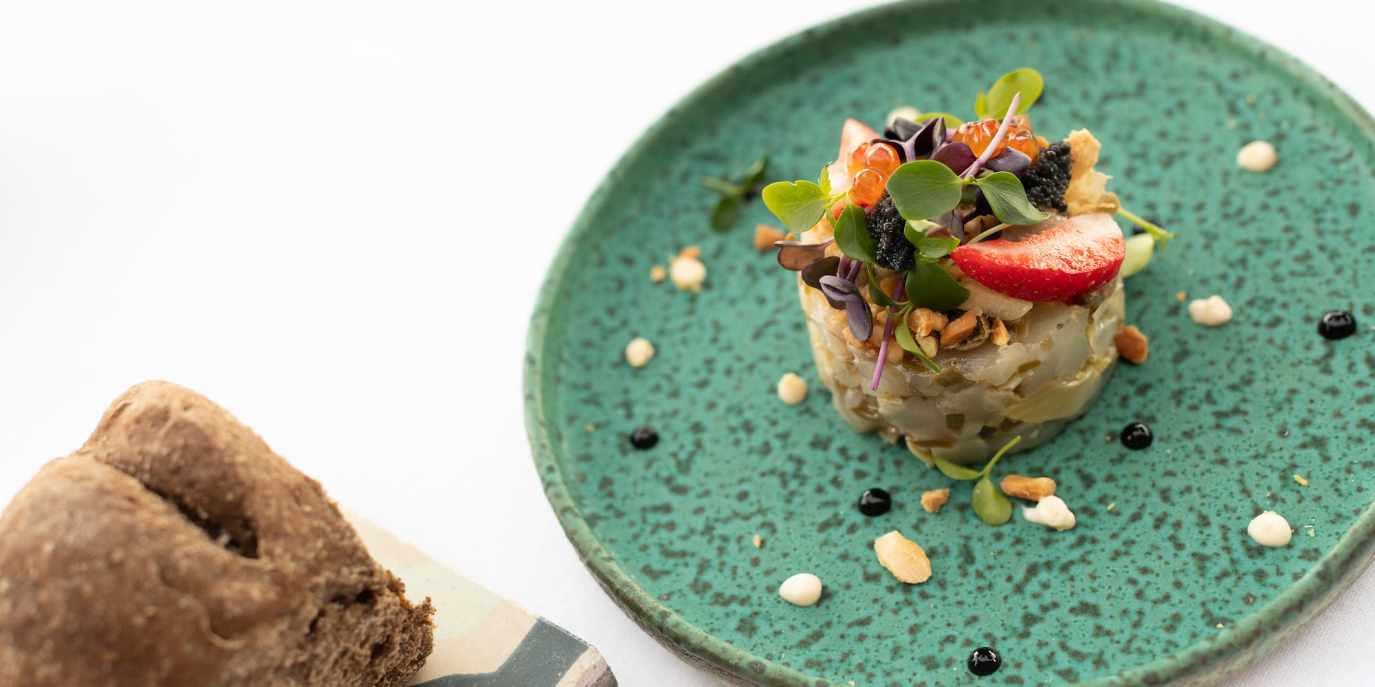 a plate of food on a white surface