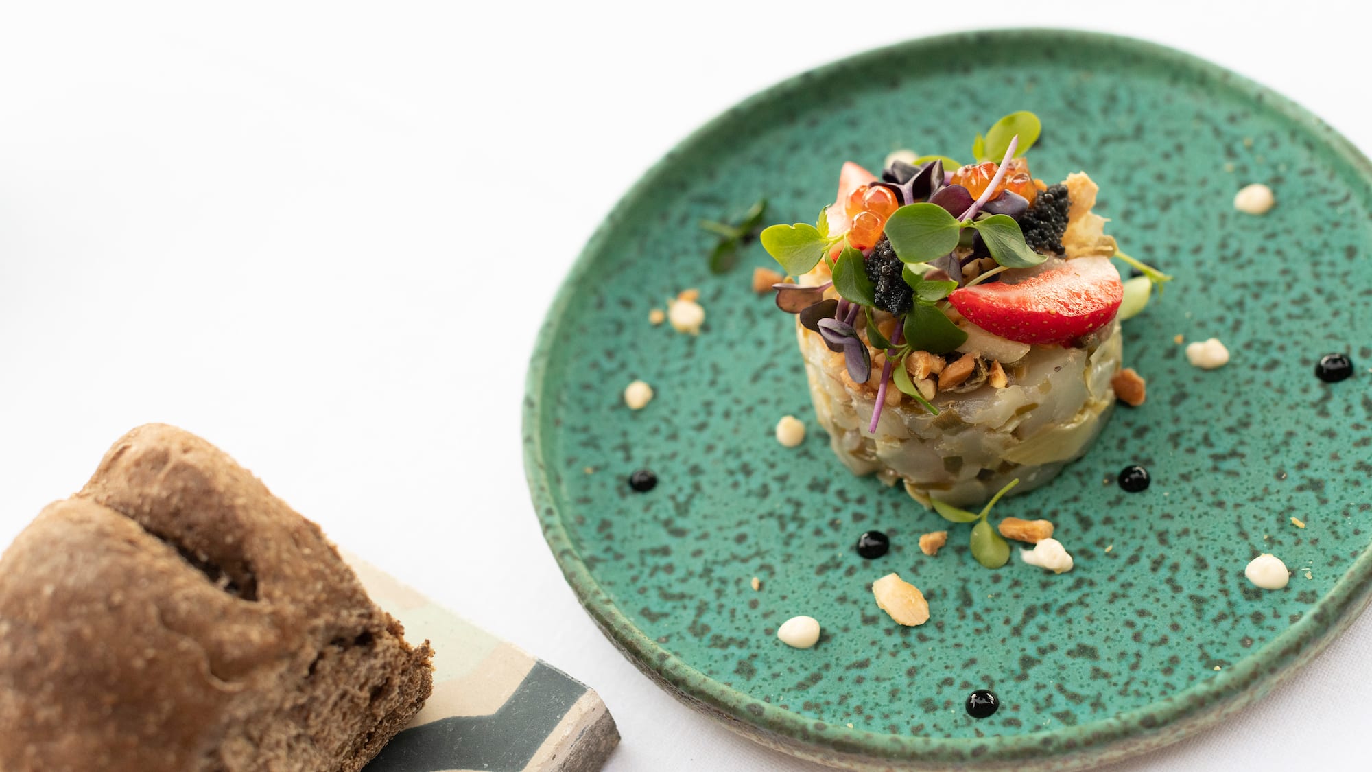 a plate of food on a white surface