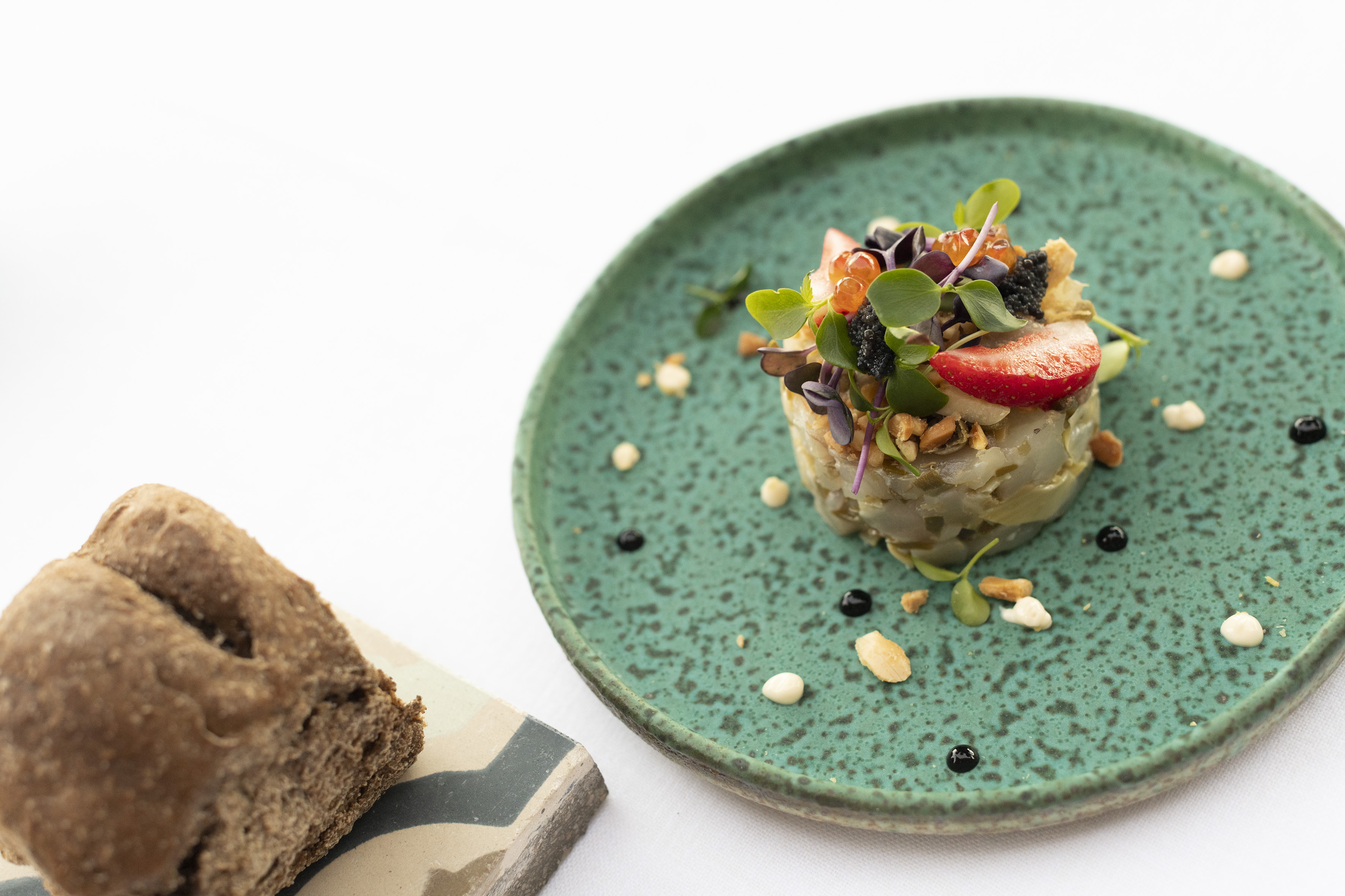 a plate of food on a white surface