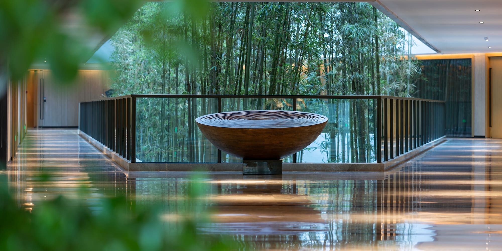 a bowl on a glass railing