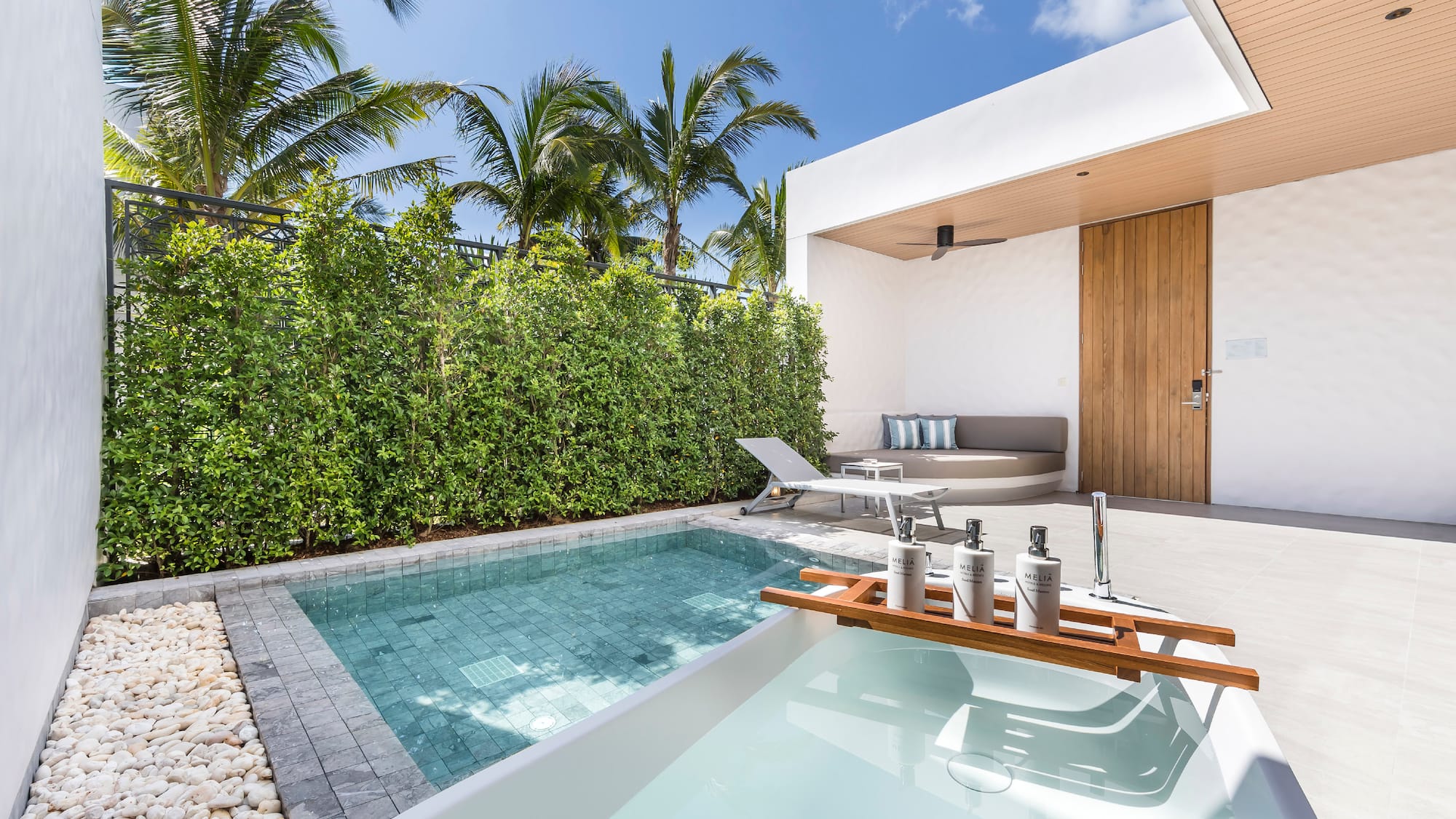 a pool and a deck with a wood tray