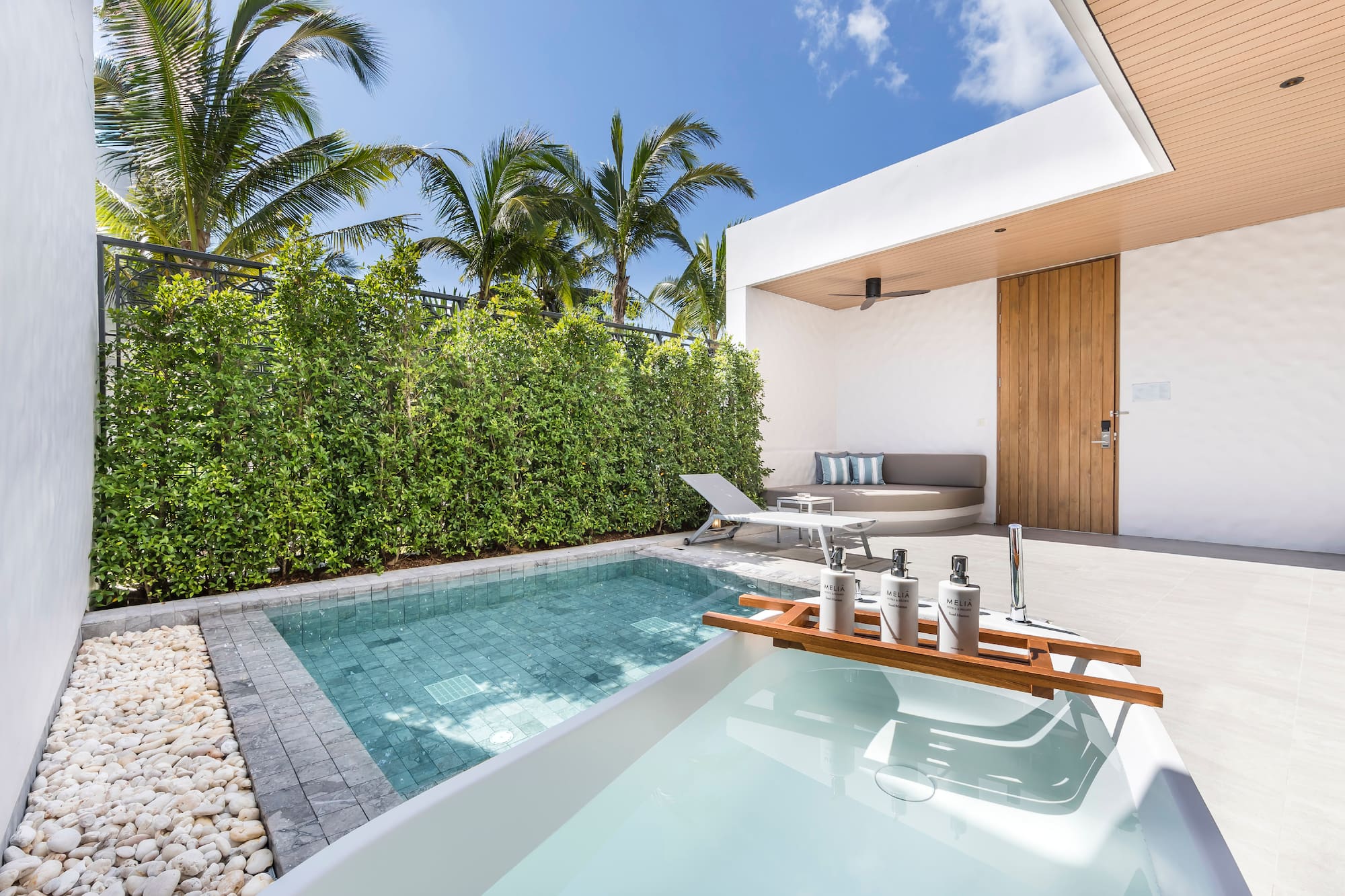 a pool and a deck with a wood tray