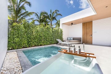 a pool and a deck with a wood tray