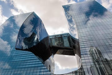 a glass building with a curved design