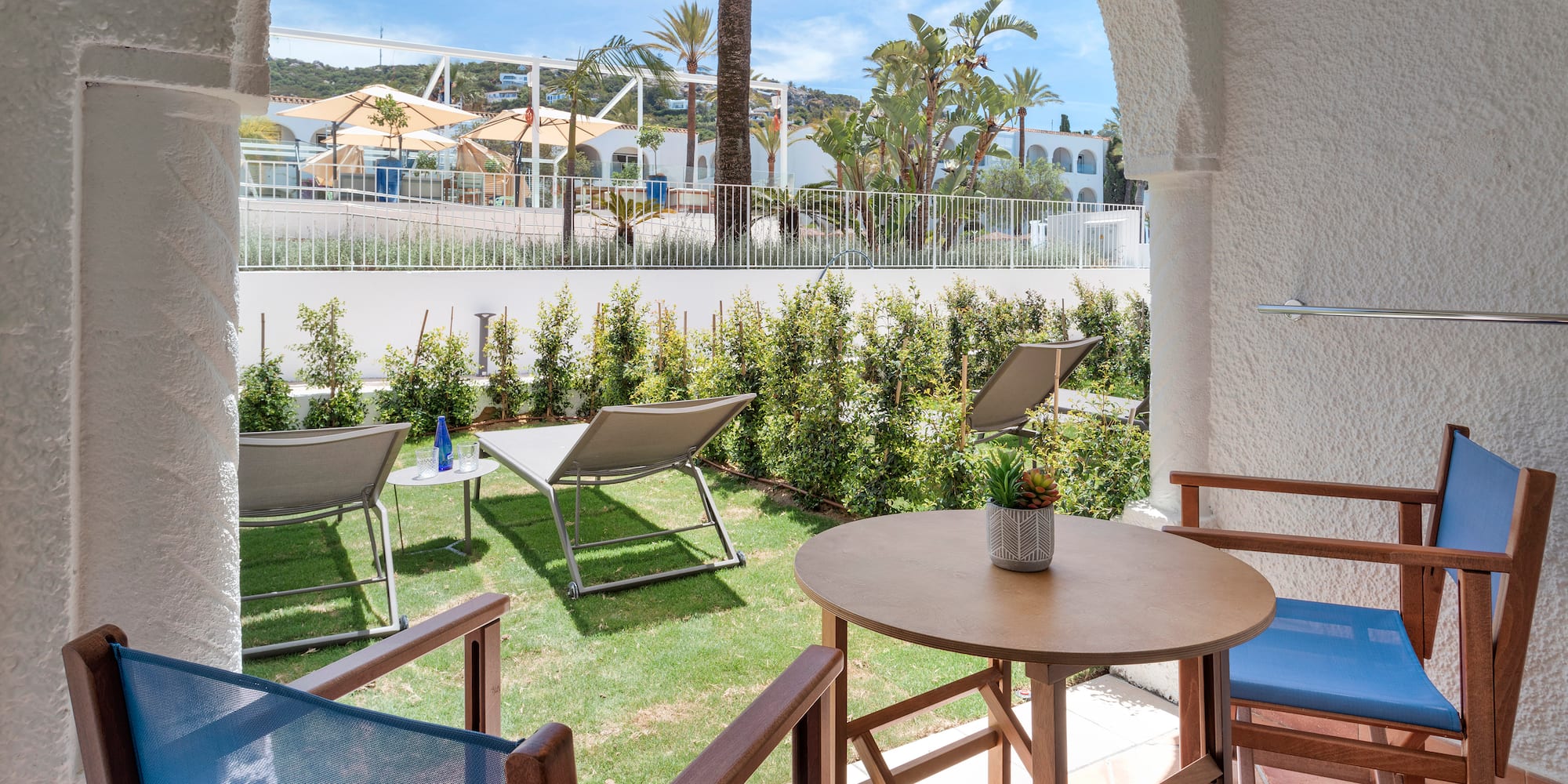 a patio with chairs and tables