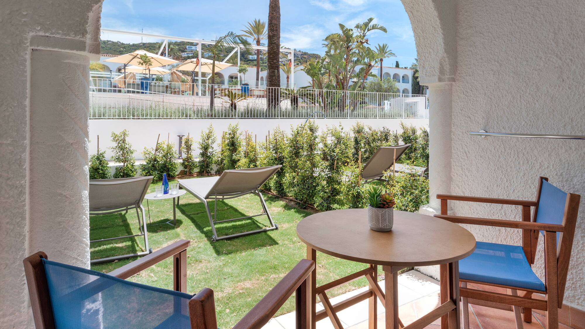a patio with chairs and tables