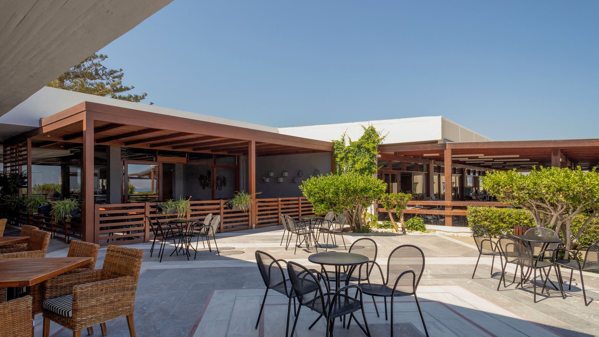 a patio with chairs and tables