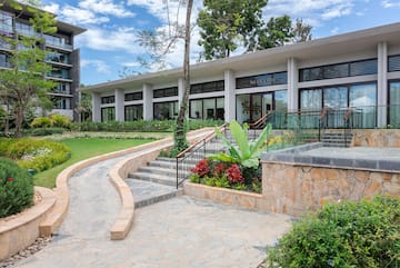 a building with a walkway and stairs