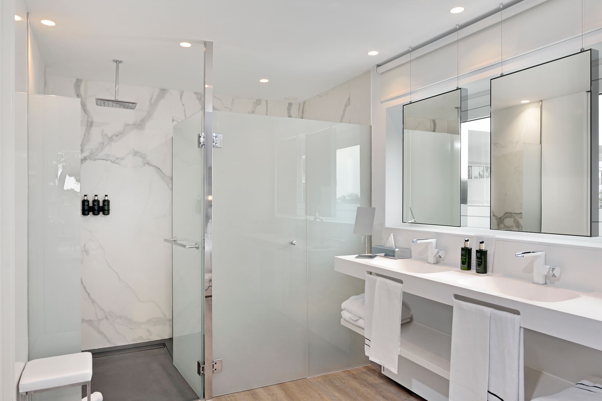 a bathroom with a shower and sink