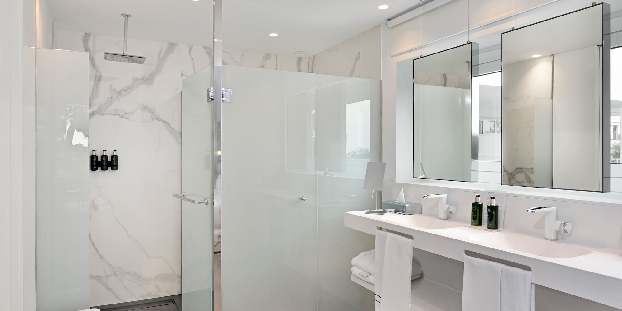 a bathroom with a shower and sink