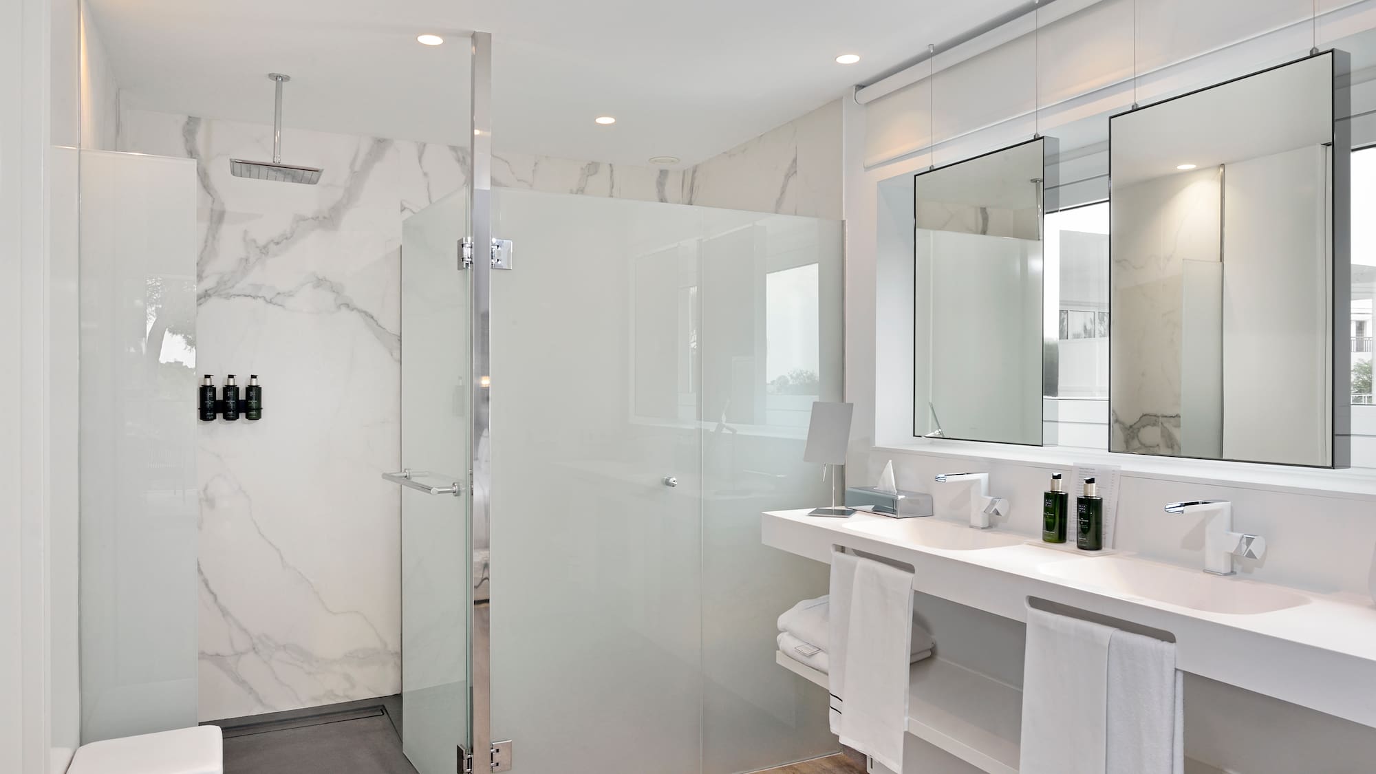 a bathroom with a shower and sink