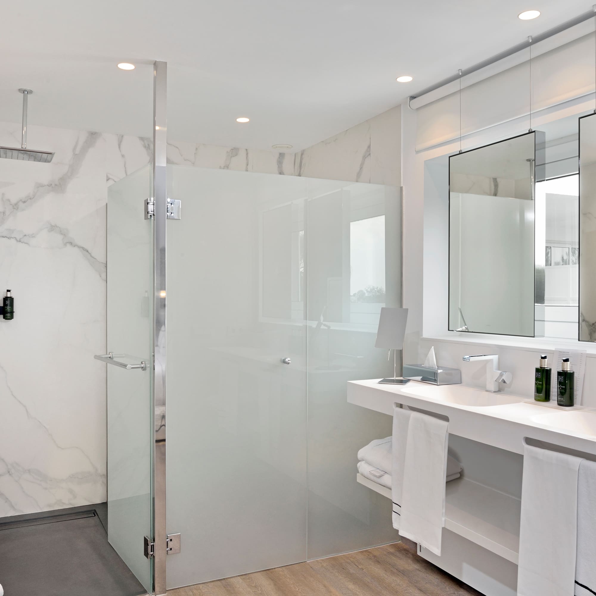 a bathroom with a shower and sink