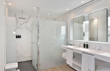 a bathroom with a shower and sink