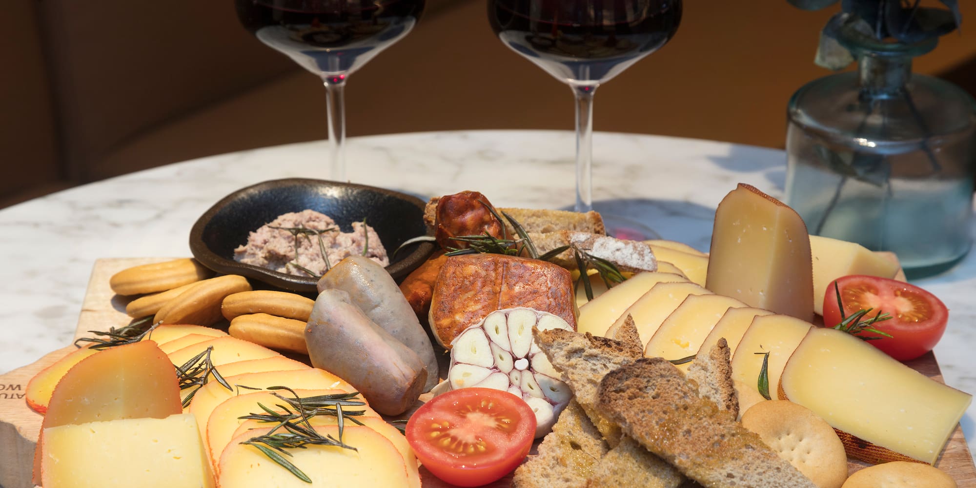 a plate of food and wine