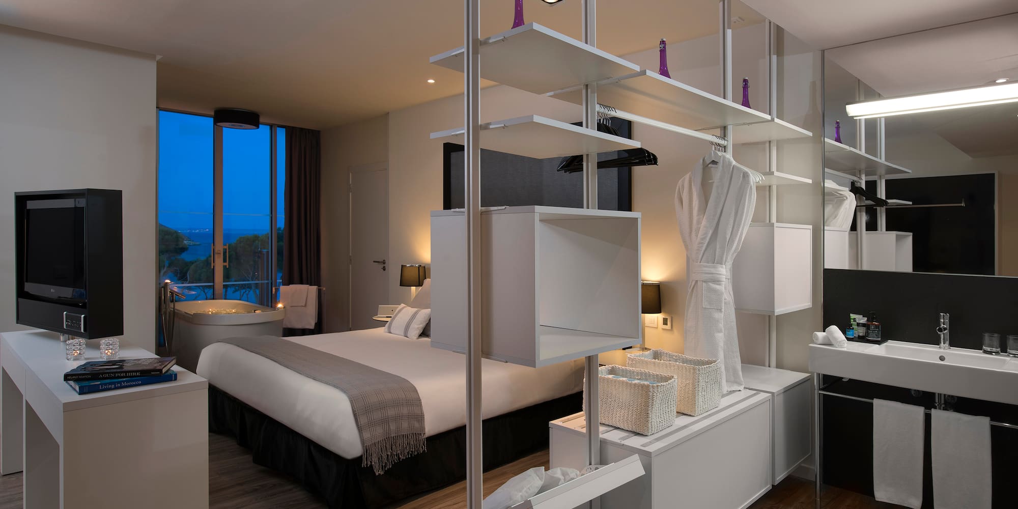 a room with a bed and a bathtub