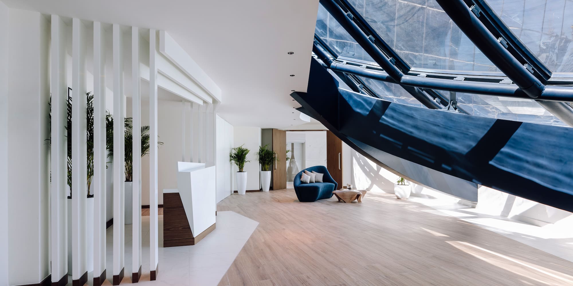 a room with a blue couch and a blue chair