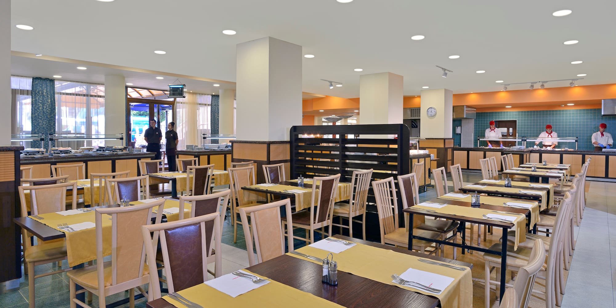 a restaurant with tables and chairs