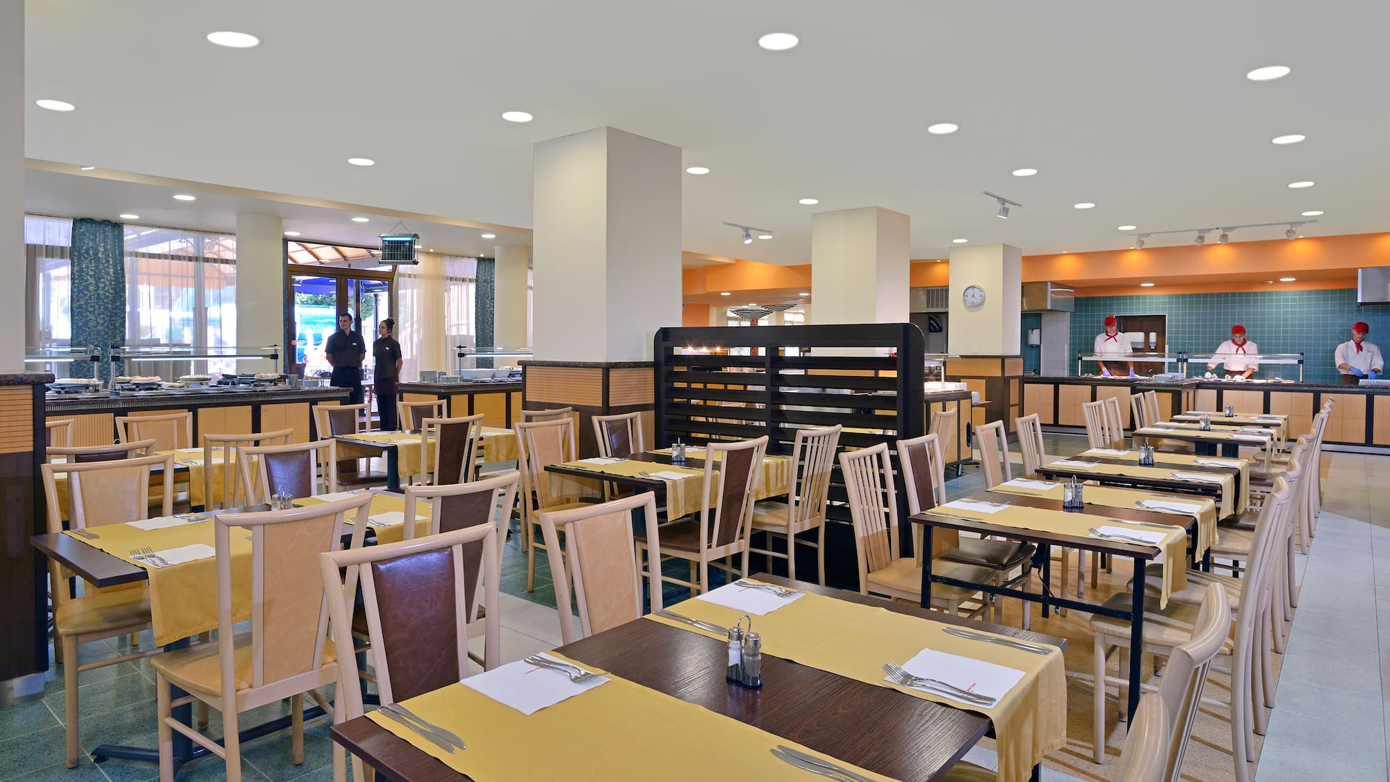 a restaurant with tables and chairs