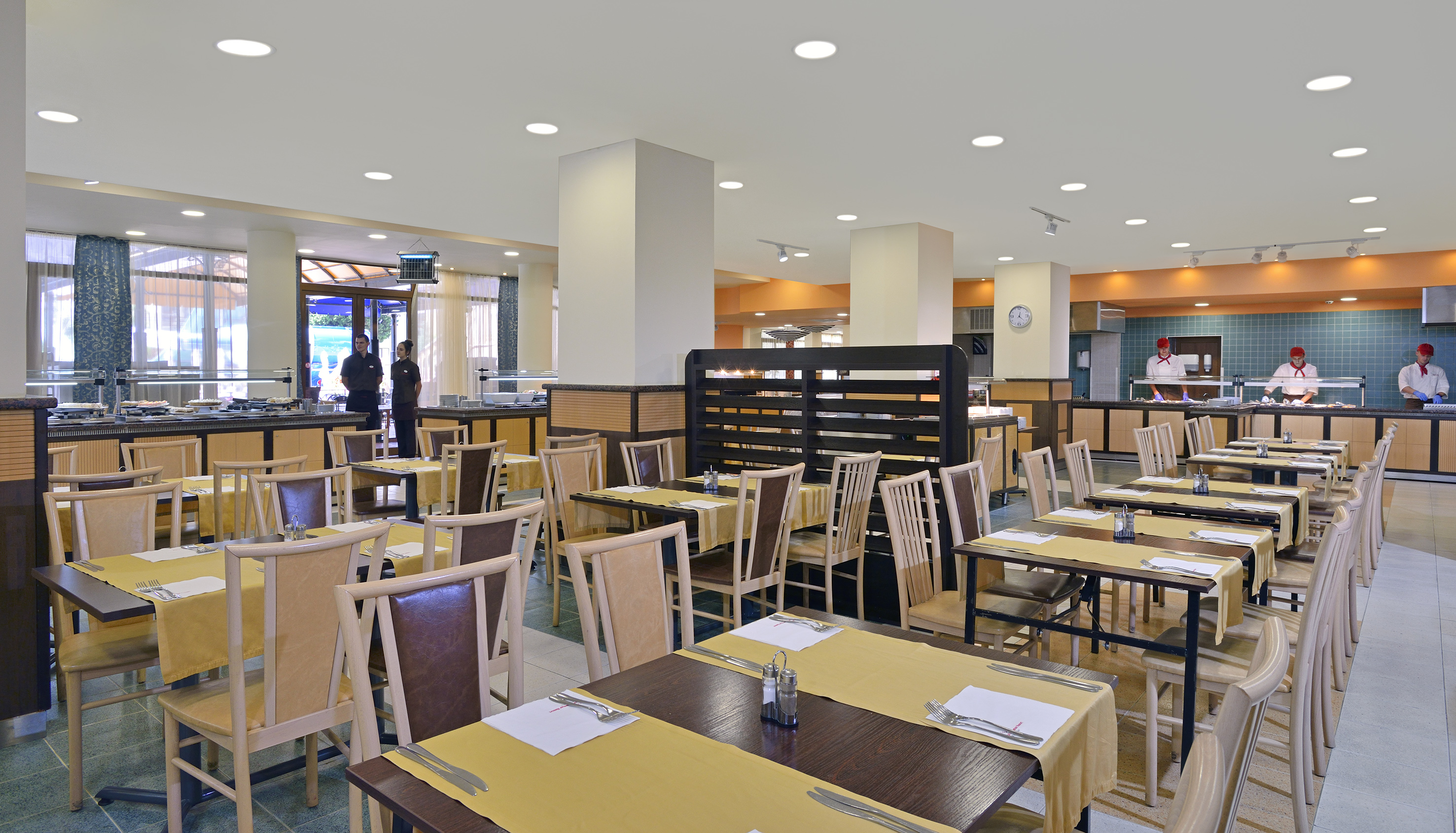 a restaurant with tables and chairs