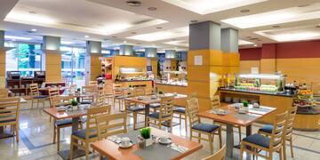 a restaurant with tables and chairs