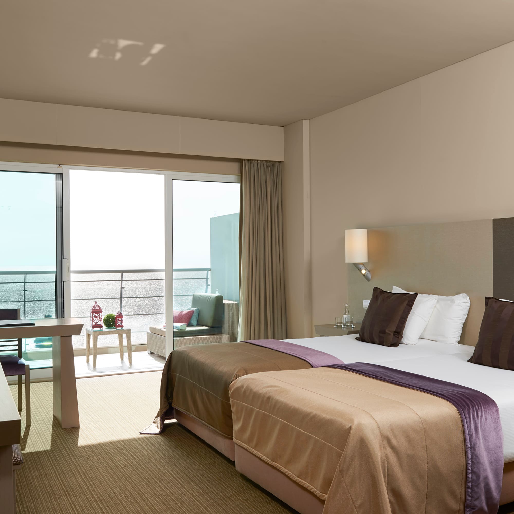 a hotel room with a large bed and a table