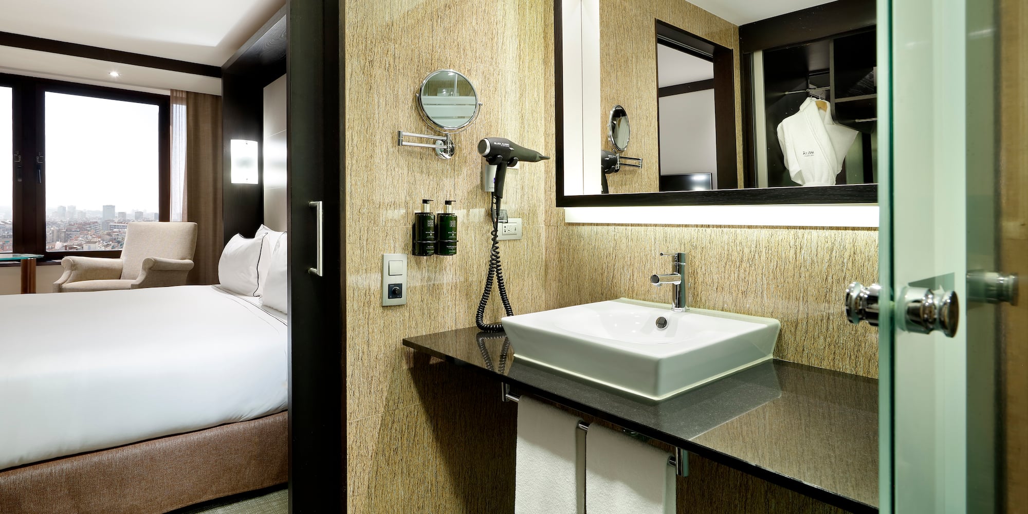 a bathroom with a mirror and a sink