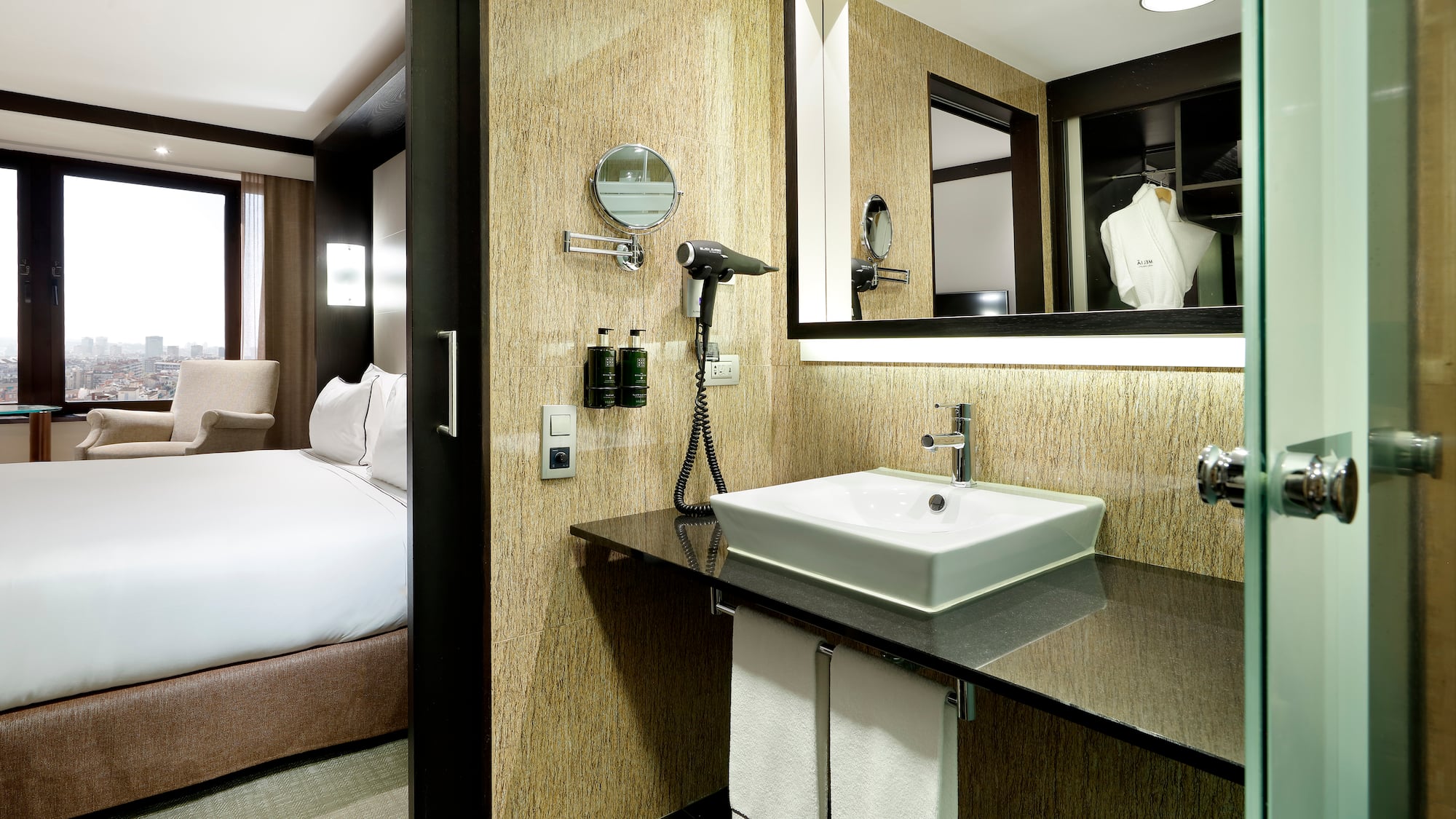 a bathroom with a mirror and a sink