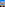 Coastal resort hotels, large swimming pool, palm trees, and blue ocean.