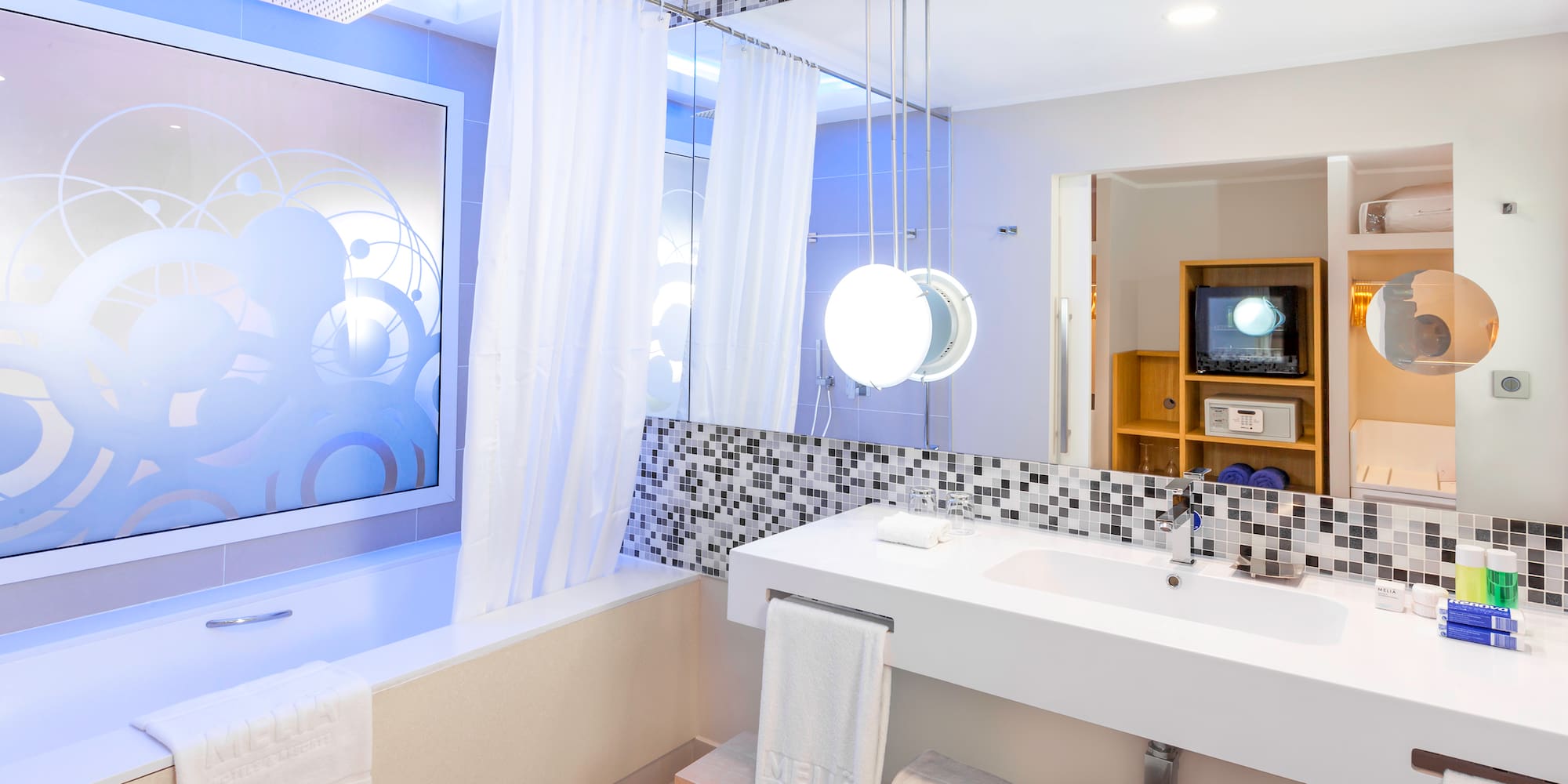 a bathroom with a bathtub and a sink